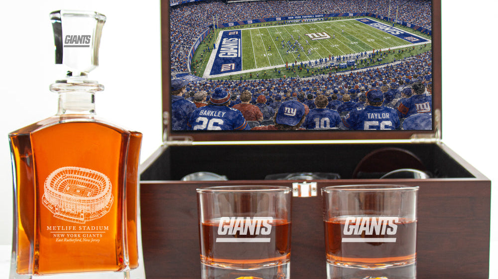 New York Giants decanter set with stadium rendering displayed in an open luxury wood box