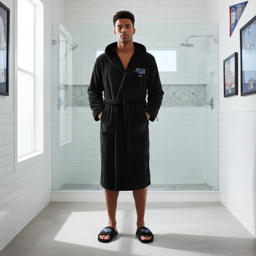 A black hooded robe with 'RAYS' and a blue logo on the front, and a pair of black fur slipper sandals with the same logo.