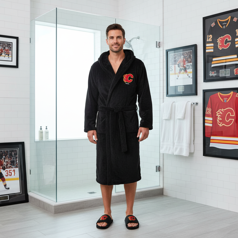 A bundle including a black hooded robe with a red flame logo on the chest and a pair of black fur slipper sandals with a red flame logo on the top.