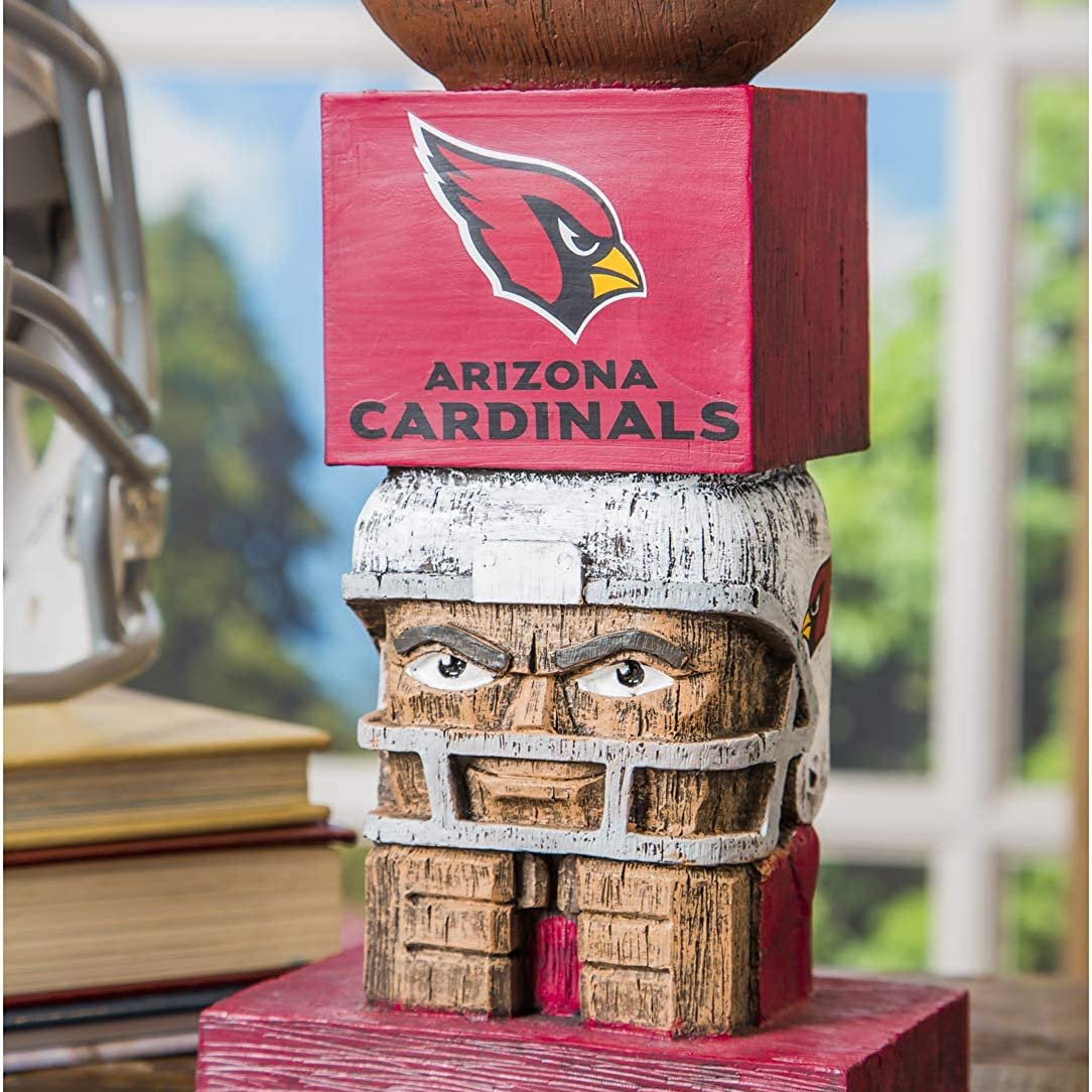 Wooden sculpture with Arizona Cardinals logo on a desk