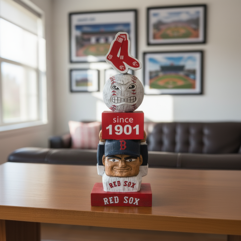 Stacked bobblehead figures with Red Sox theme on a table in a room with sports-themed decor.