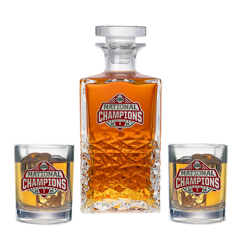 Decanter and two glasses with 'National Champions' logo on a white background