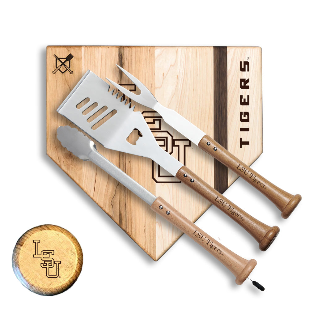 Barbecue utensils with wooden handles on a cutting board with 'Tigers' branding.
