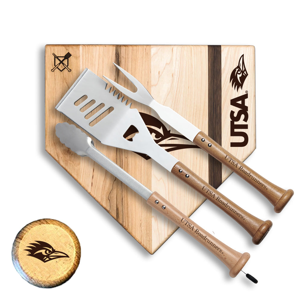 UTSA branded barbecue utensils on a cutting board with UTSA logo.