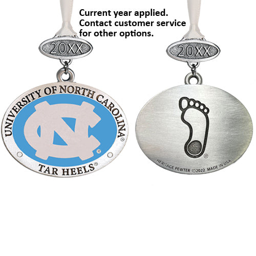 Two metal pendants with University of North Carolina logo and footprints on a white background.