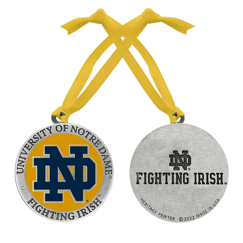 Two medals with University of Notre Dame logo and text on a white background