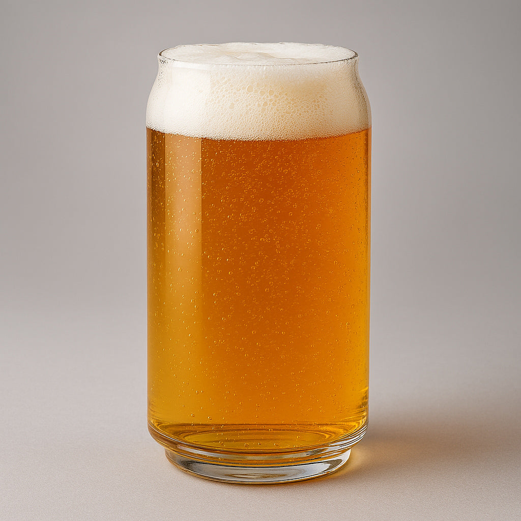 Glass of beer with a white head on a gray background