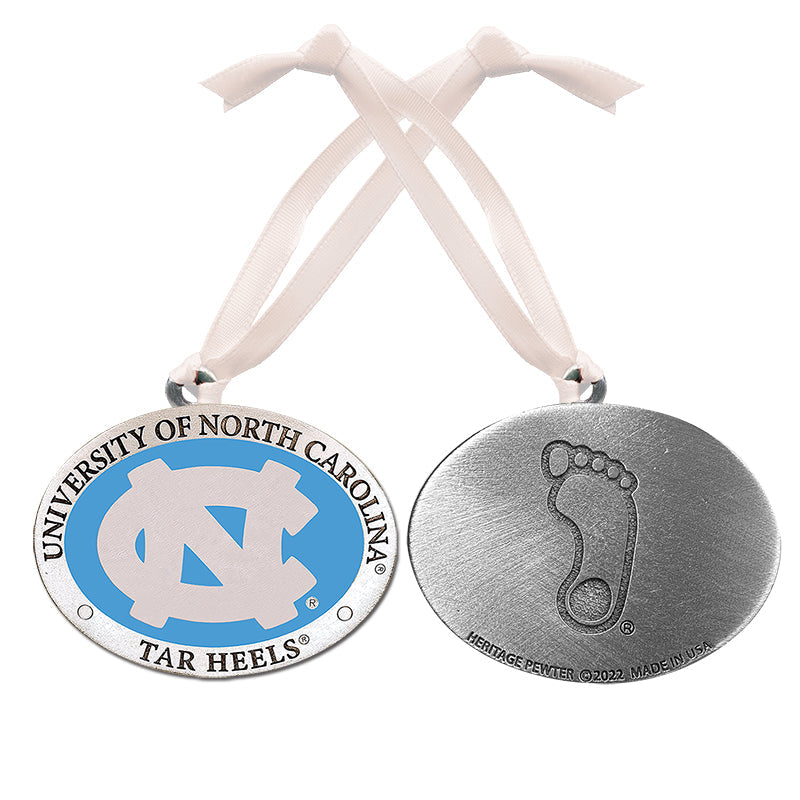 Two metal medallions on ribbons, one with UNC logo and the other with footprints, on a white background.
