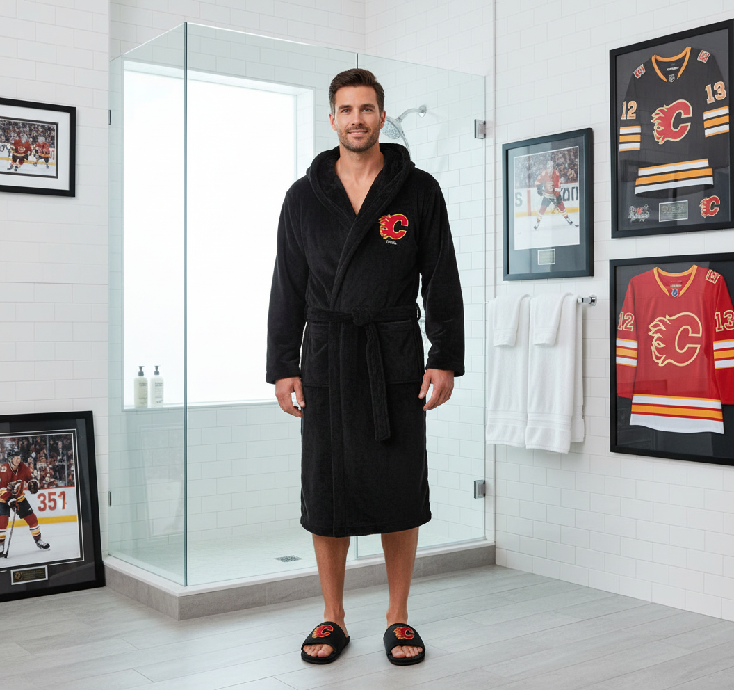 A bundle including a black hooded robe with a red flame logo on the chest and a pair of black fur slipper sandals with a red flame logo on the top.