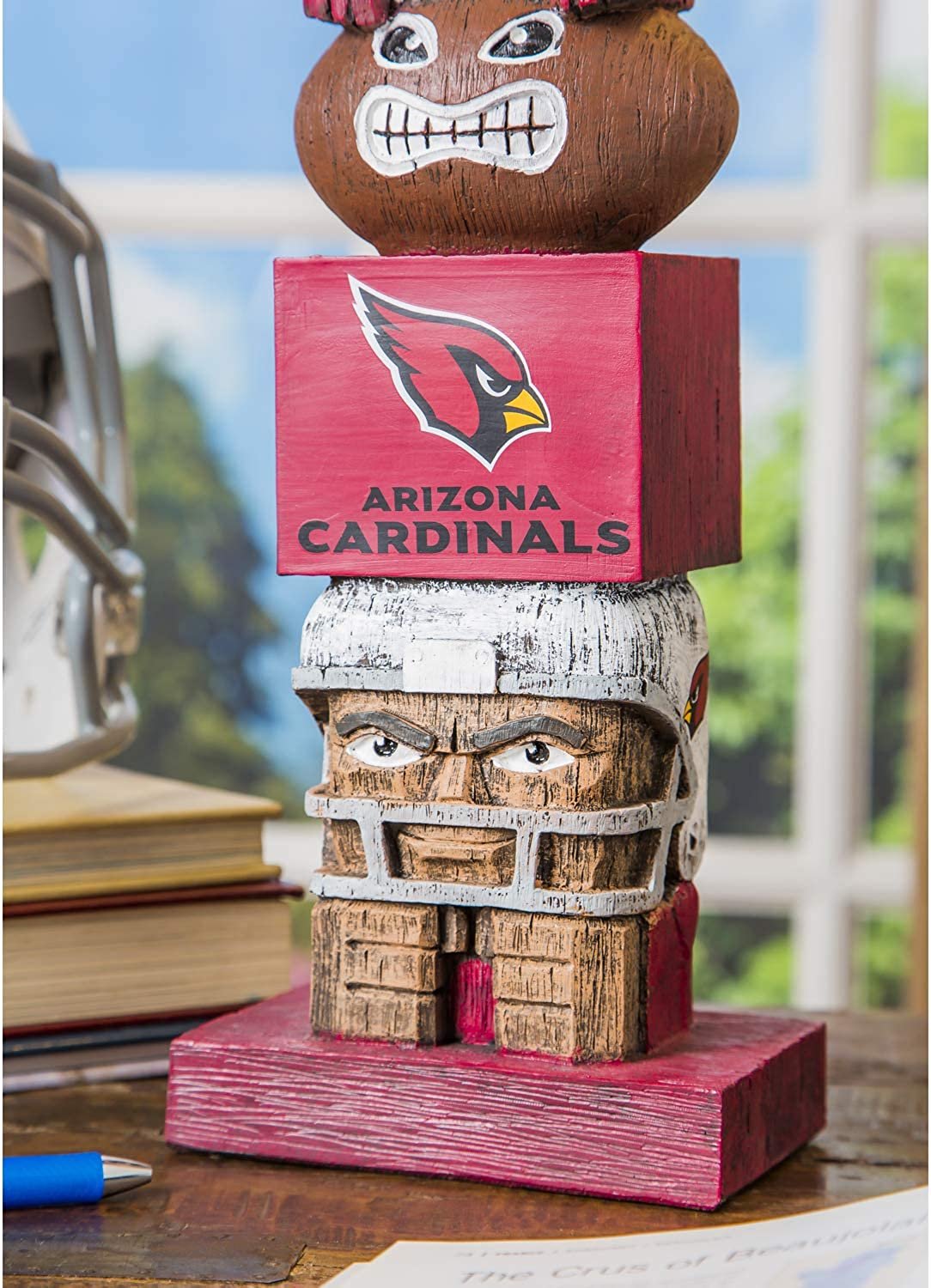 Wooden sculpture with Arizona Cardinals logo on a desk