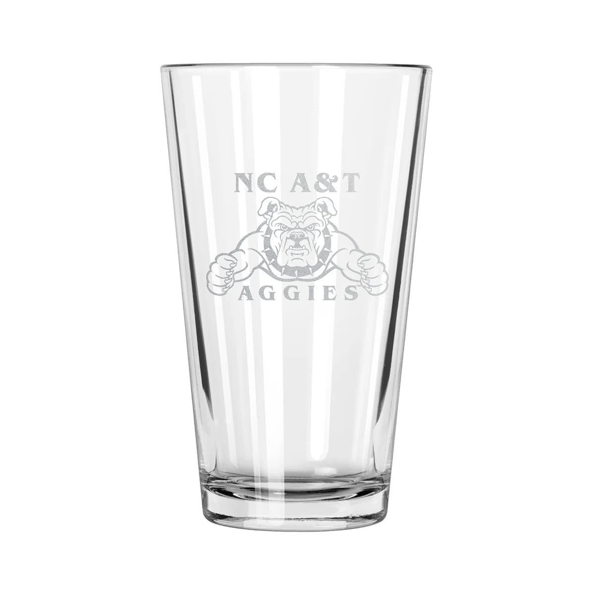 A clear pint glass with etched design of the North Carolina A&T Aggies logo.