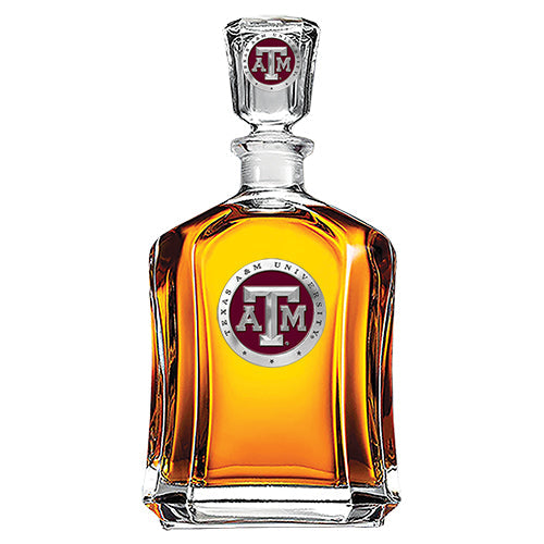 Glass decanter with Texas A&M University logo on a white background