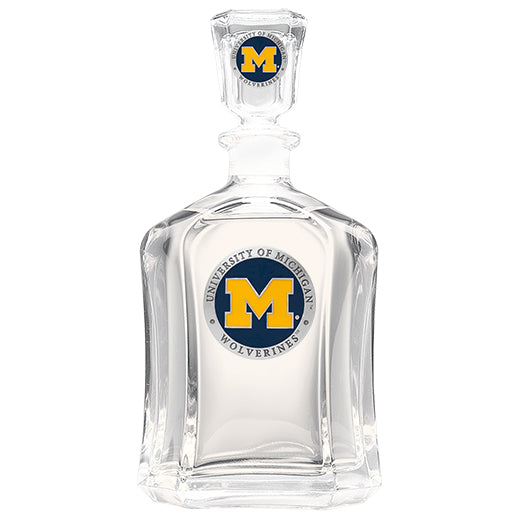 Clear glass decanter with University of Michigan Wolverines logo on a white background