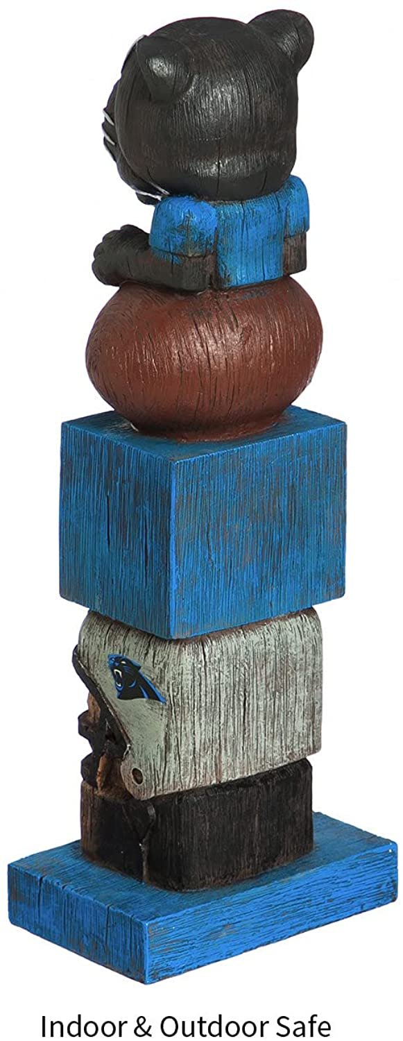 Wooden totem pole with animal figure on a blue base