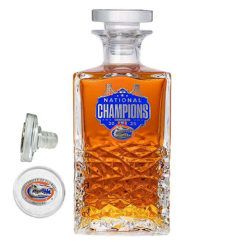 Glass decanter with 'National Champions' label on a white background
