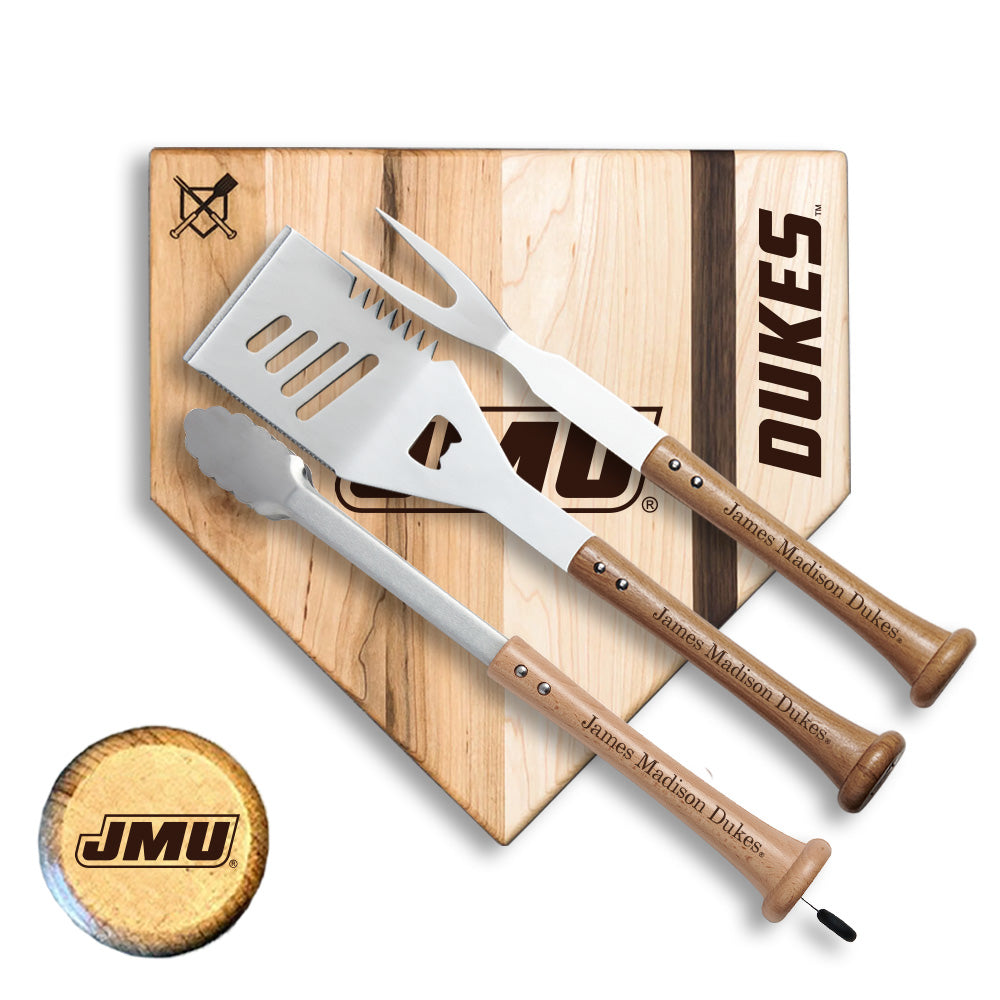 Set of three metal spatulas with wooden handles on a wooden cutting board with 'Dukes' branding.