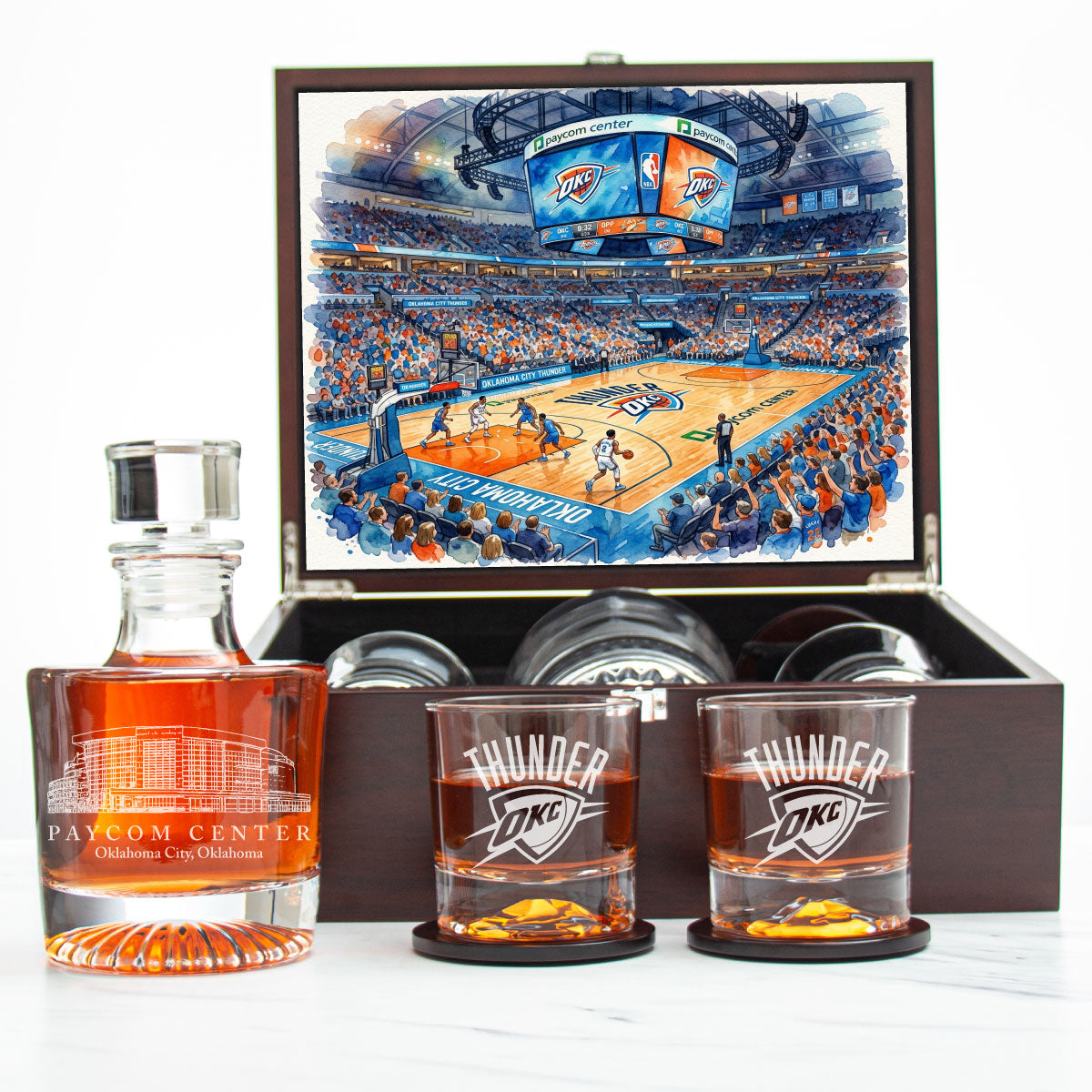 Oklahoma City Thunder-themed whiskey set with decanter and glasses in front of a basketball arena illustration.