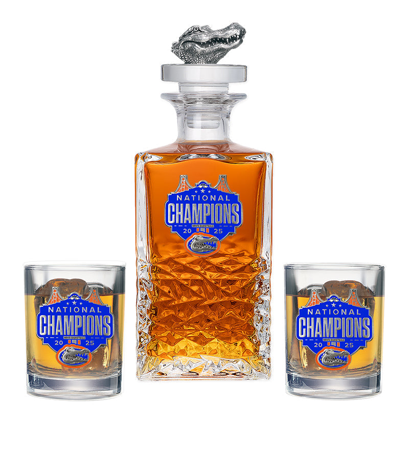 Decanter and two glasses with 'National Champions' label on a white background