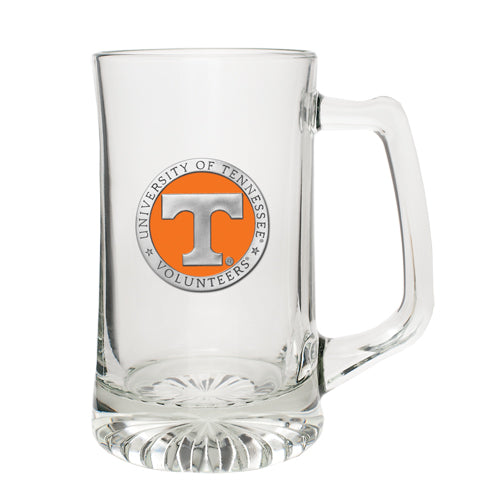 A clear glass stein with a orange and white University of Tennessee logo 3D pewter detailing.