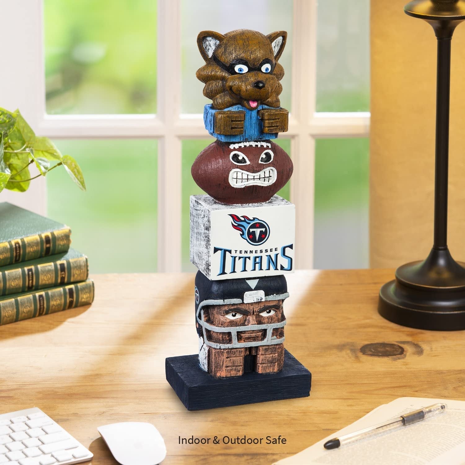 Tribal figurine with Tennessee Titans logo on a wooden desk