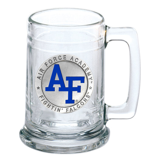 A clear glass stein with a silver handle and a 3D pewter casting of the US Air Force Academy logo in blue and gray colors.