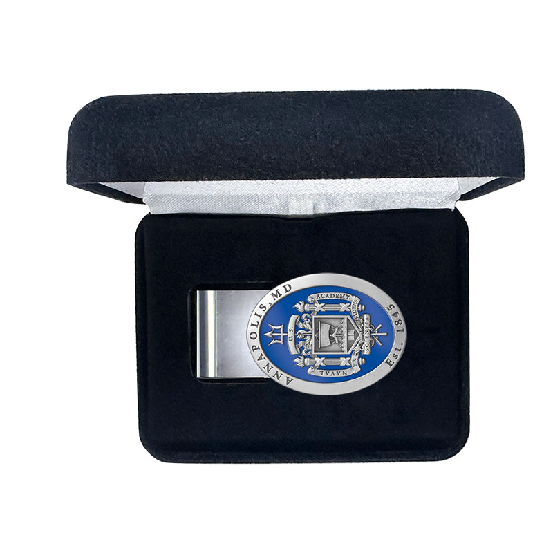 Silver money clip with blue emblem in a black velvet box on a white background