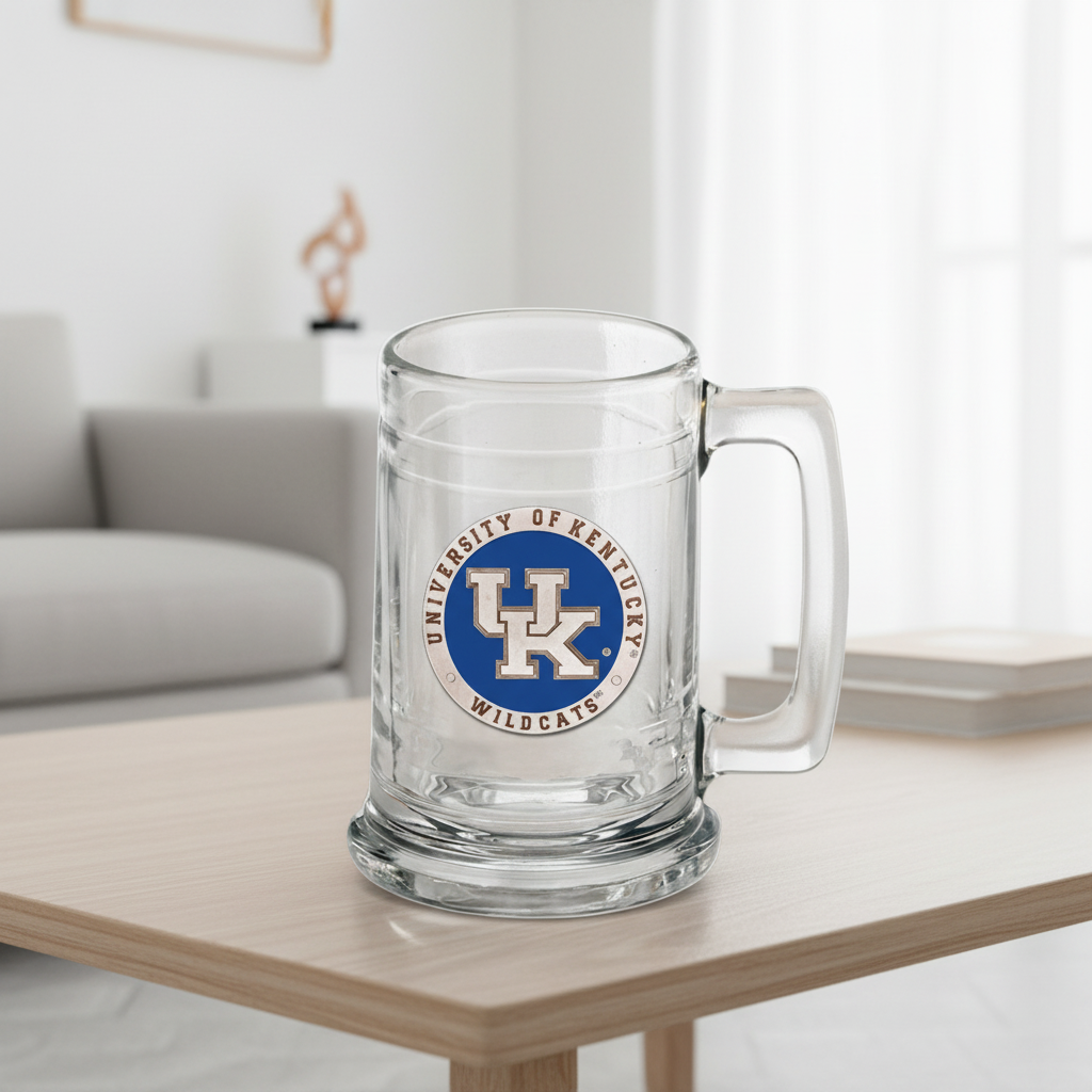 Glass mug with University of Kentucky Wildcats logo on a wooden table.