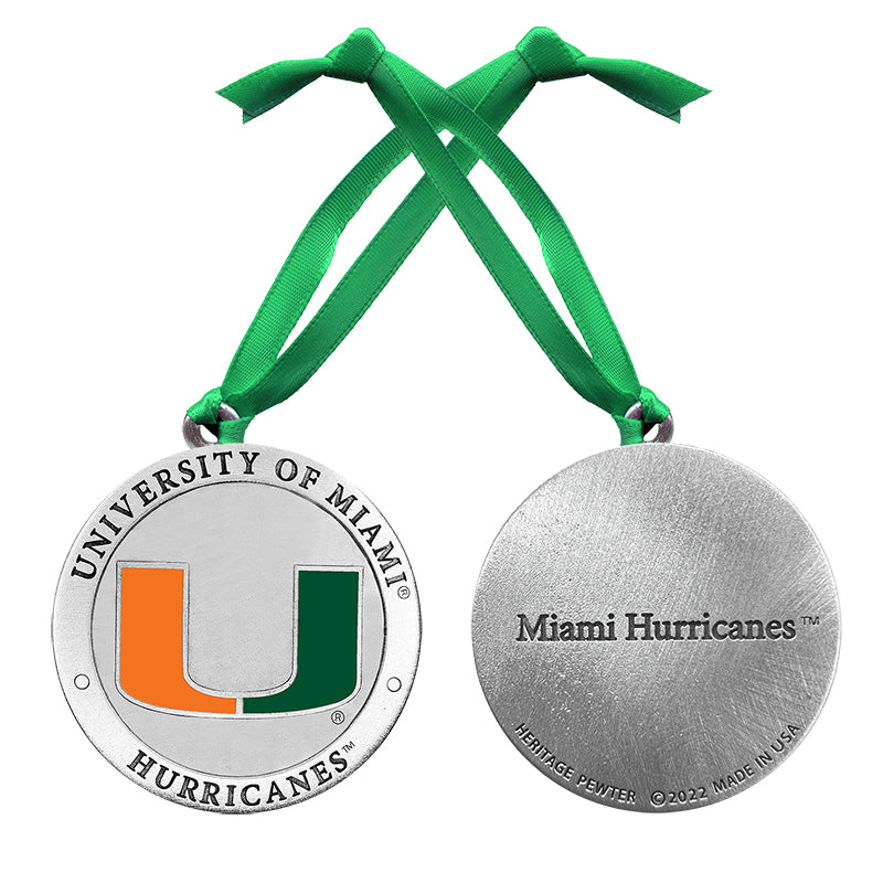 Medal with University of Miami Hurricanes logo and green ribbon on a white background