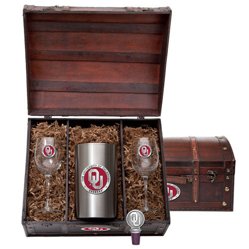 Gift set with two wine glasses, a tumbler, and a bottle opener in a wooden crate.