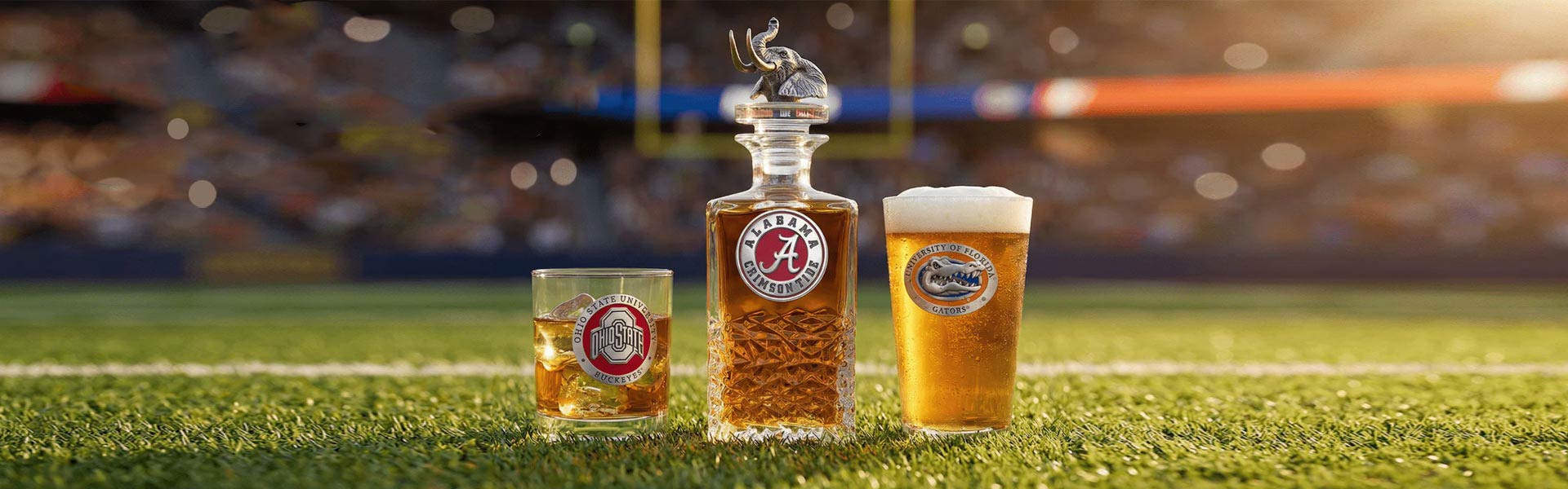 Two glasses of beer with a decanter on a sports field background