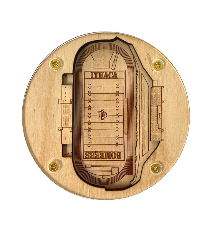 Wooden model of a stadium with laser engraving on a white background